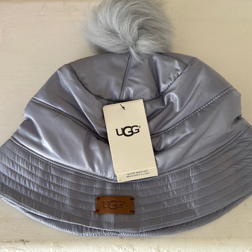 UGG Silver Puffer Hat with Faux Fur Pom. New With Tags